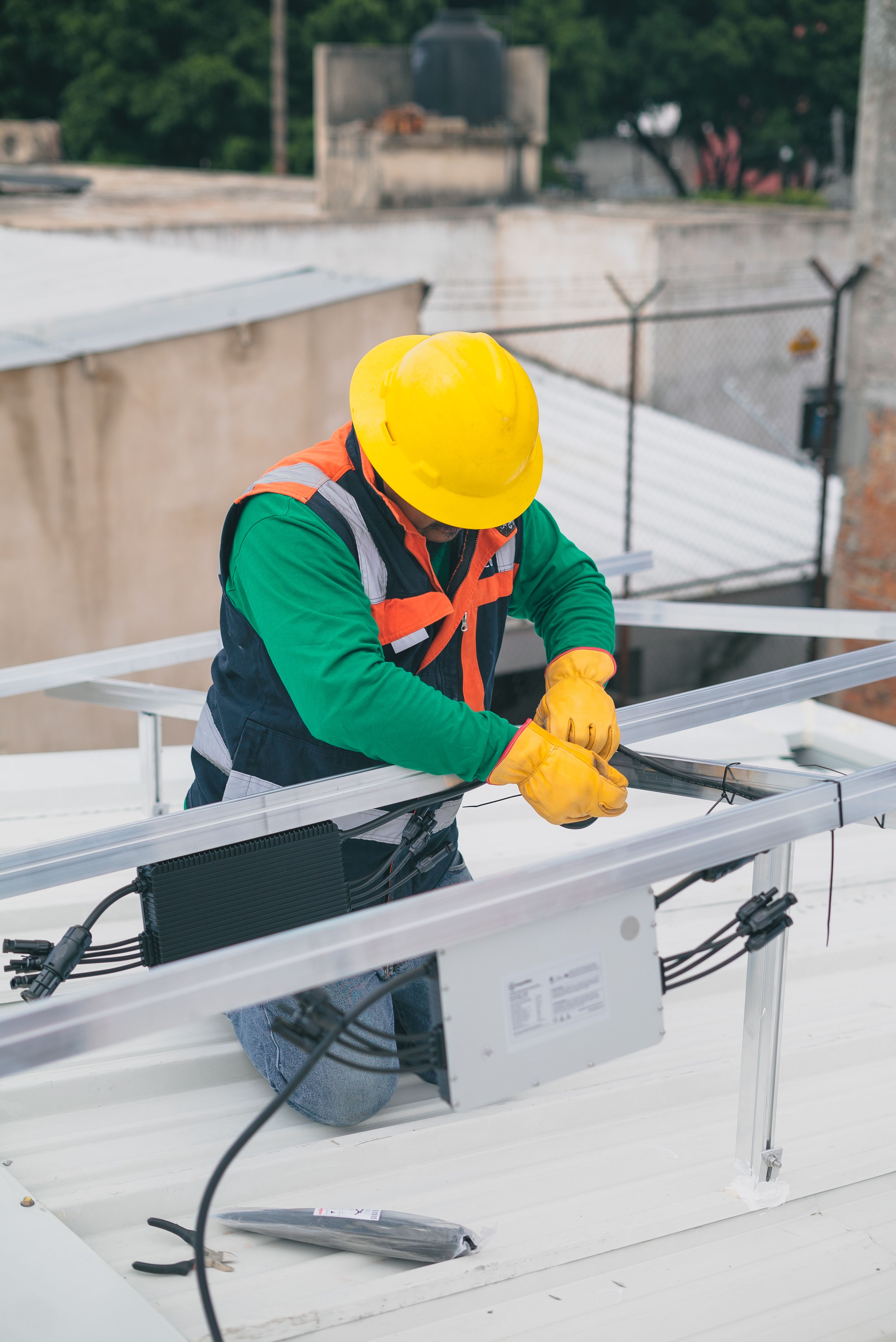 Electrician installing electrical components in commercial building